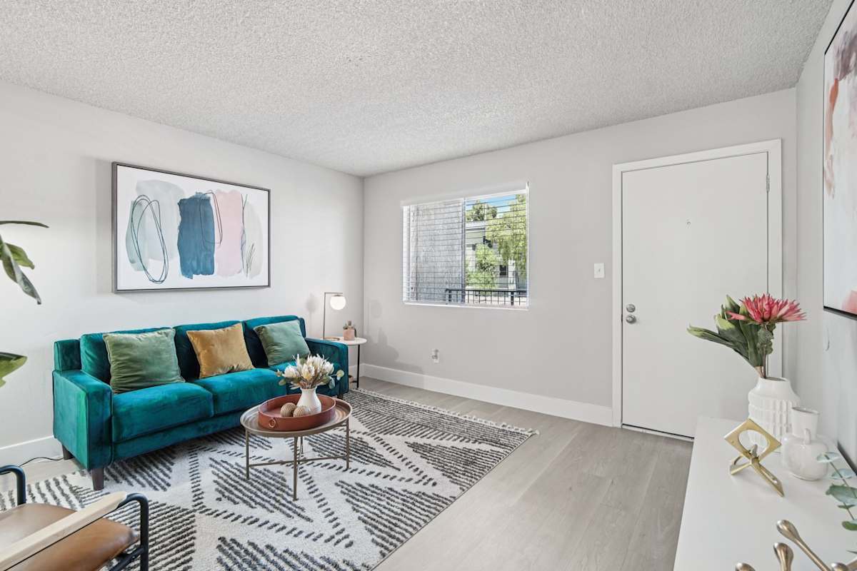 Furnished apartment living area shown — representative home at Ardella on 28th.