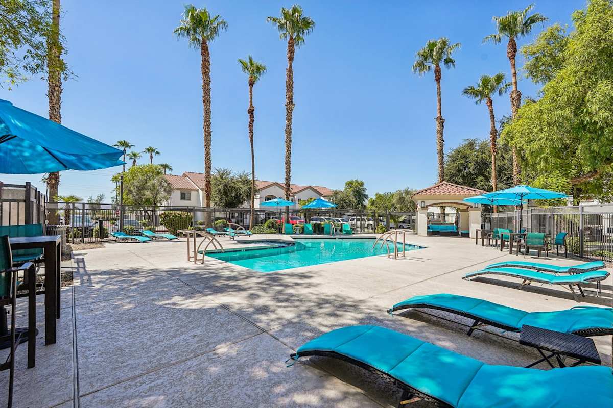 Pool and poolside area at Del Mar Apartments.