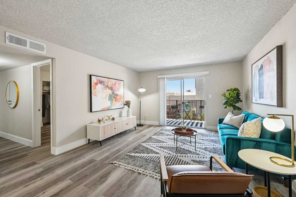 Furnished apartment living area shown — representative home at Ardella on 28th.