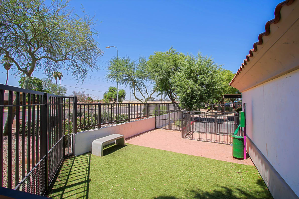 Enclosed dog exercise area at Del Mar Apartments.