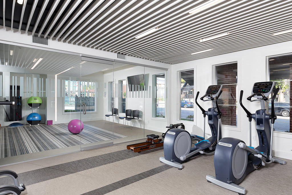 City Place at Westport fitness center cardio equipment and yoga room - Kansas City, MO