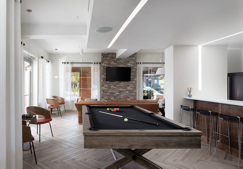 City Place at Westport resident clubhouse lounge with TVs and pool table - Kansas City, MO