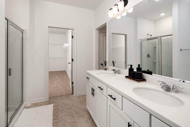 Overlook at Kennerly Lake primary bathroom with double vanity and walk-in shower - Grayson, GA