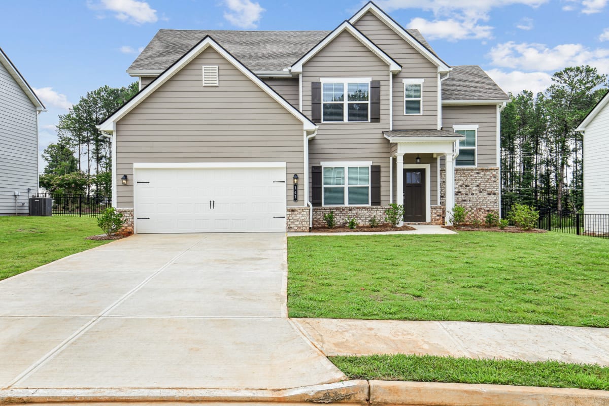 Overlook at Palisades Homes exterior of two-story home with driveway and garage - Dallas, GA