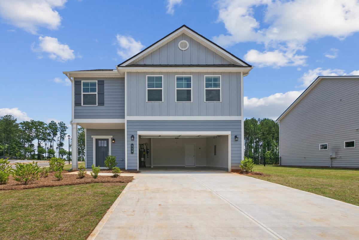 Alma Farms Rosewood exterior with private driveway and attached garage - Hoschton, GA