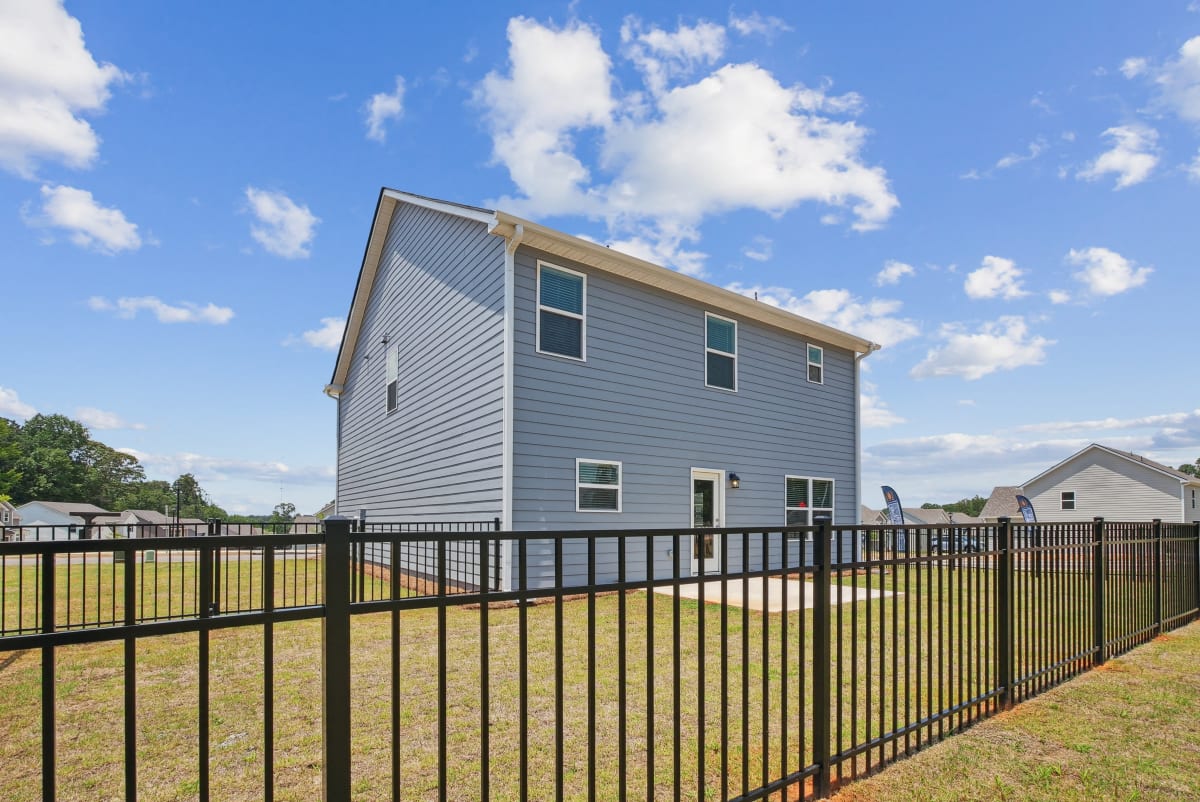 Alma Farms back patio with fenced yard - Hoschton, GA
