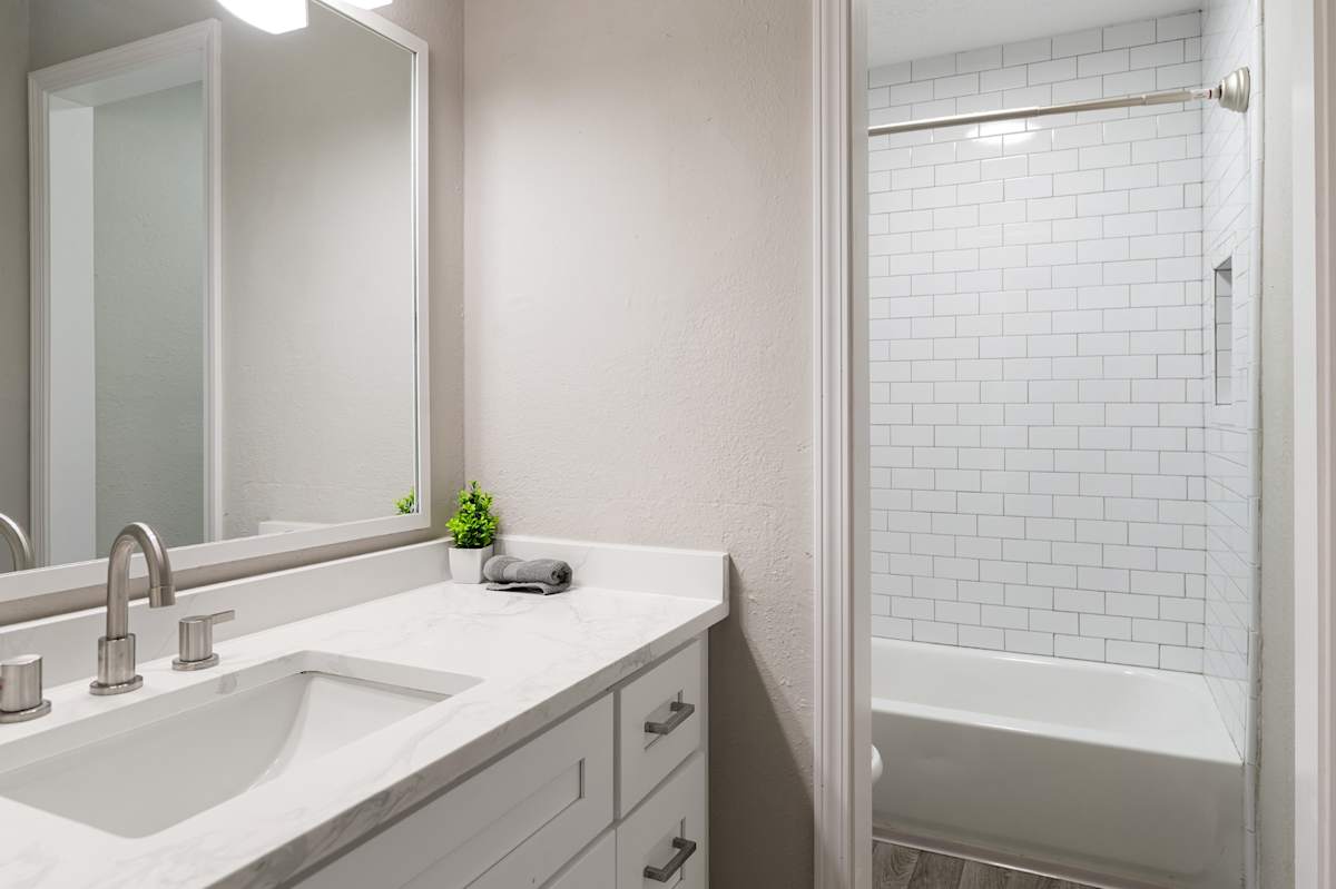 Dunwoody Glen renovated bathroom vanity with white cabinets - Atlanta, GA