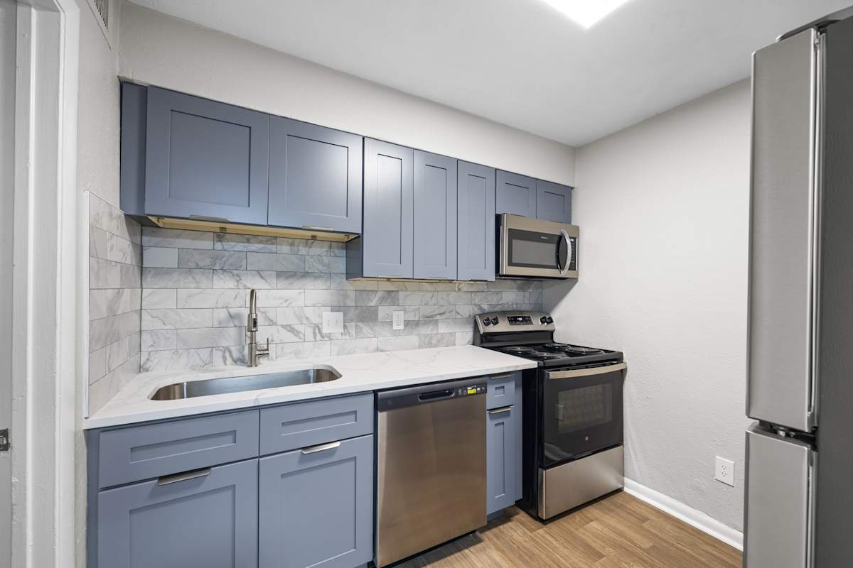 Dunwoody Glen renovated kitchen with blue cabinets - Atlanta, GA