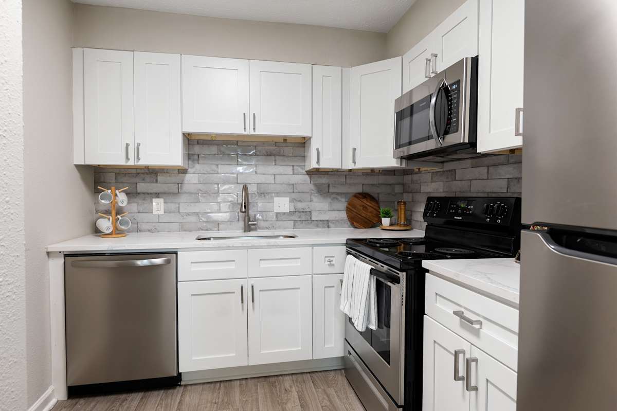 Dunwoody Glen renovated kitchen with white cabinets - Atlanta, GA