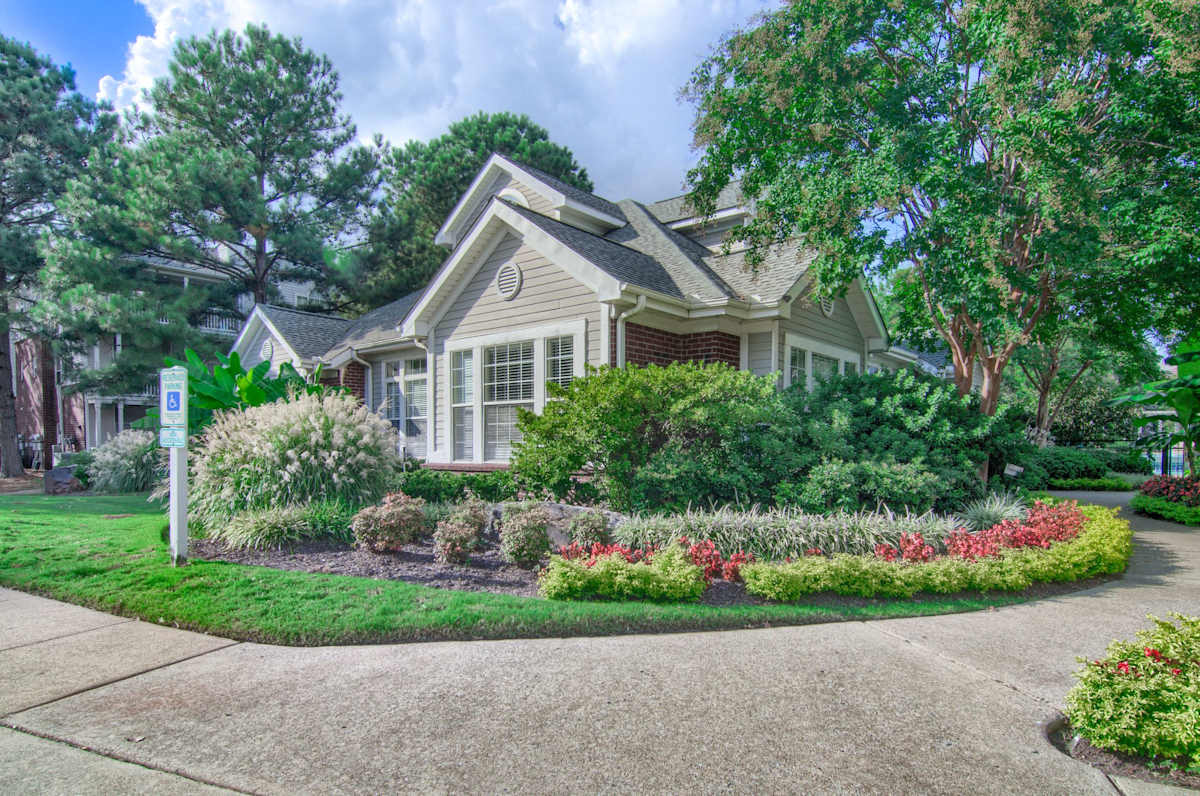 Enclave at Wolfchase leasing office exterior with landscaping - Memphis, TN