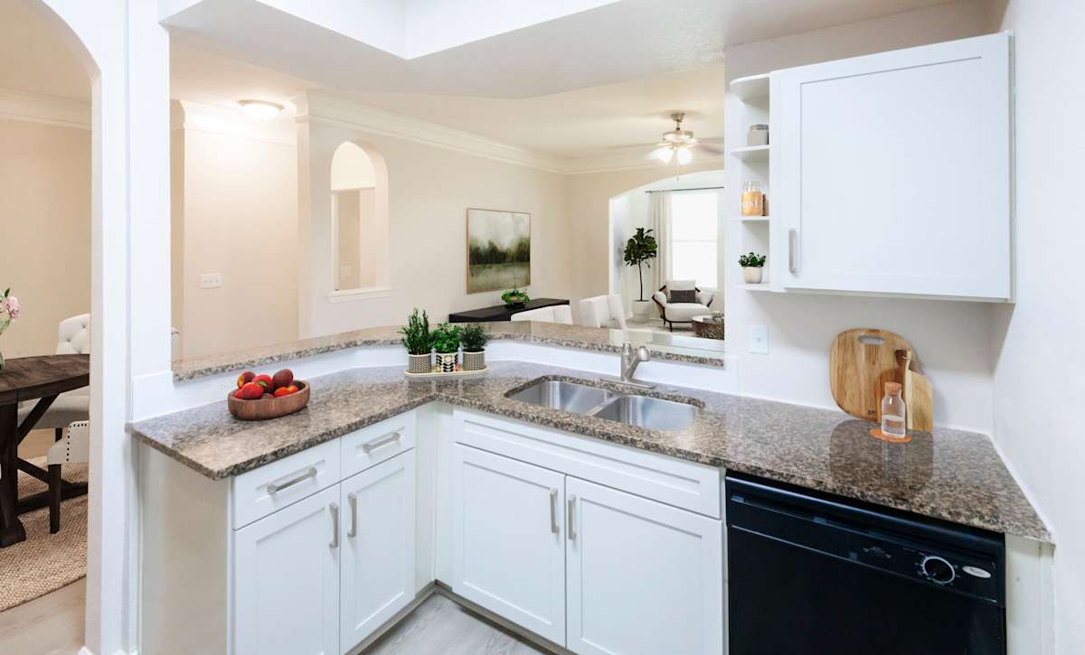 The Fenwick Apartment Homes kitchen with white cabinets - Humble, TX