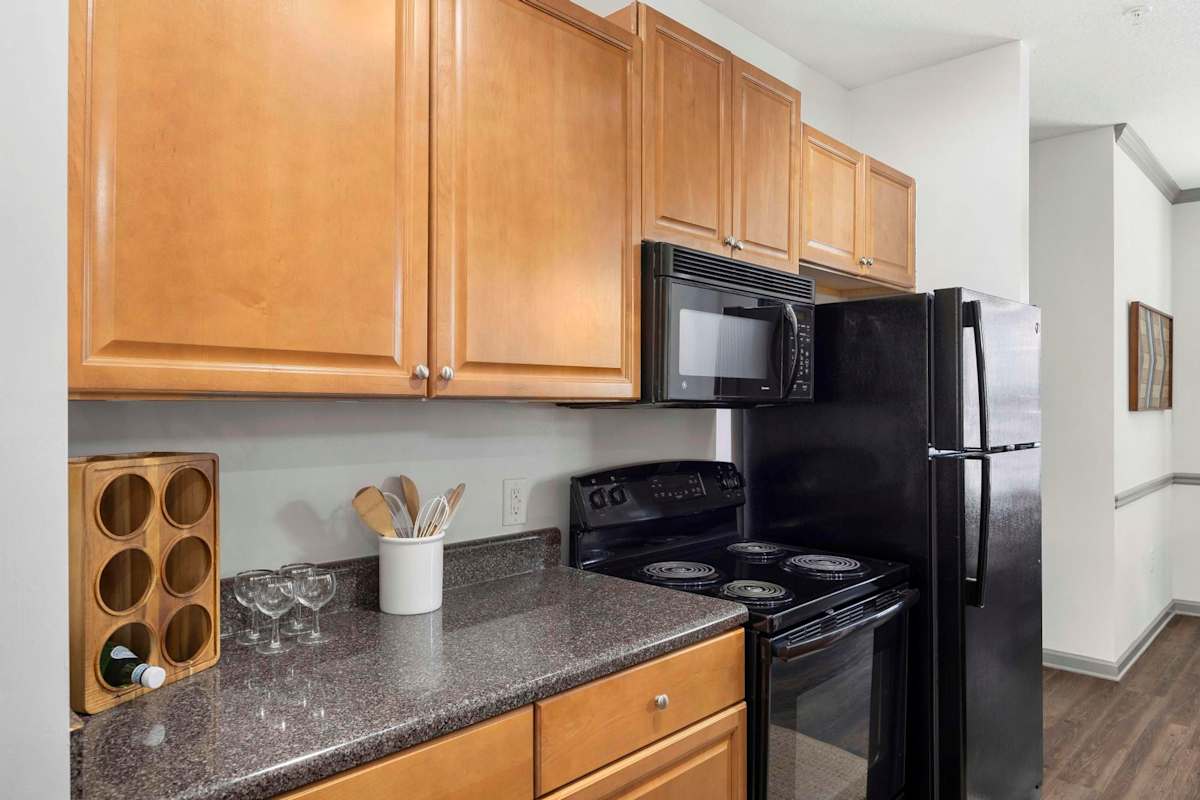 The Shallowford kitchen with black appliances - Chattanooga, TN