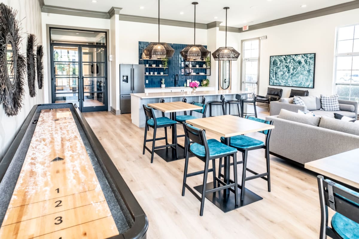 Grand Island Apartments clubhouse lounge with shuffleboard - Memphis, TN