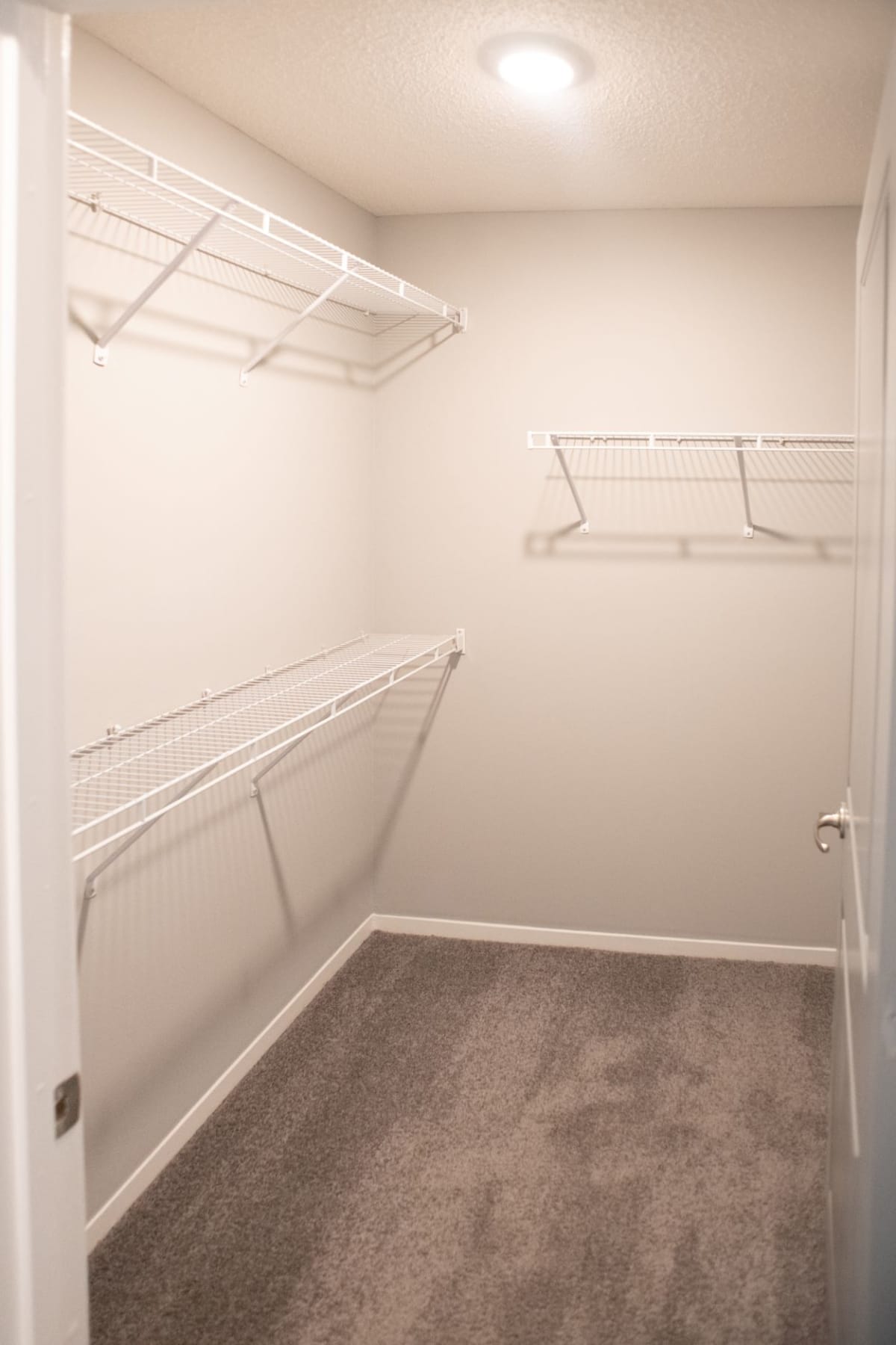 Grand Island Apartments model bedroom closet storage - Memphis, TN