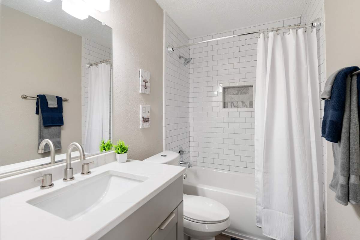 Mill House at East Cobb renovated bathroom with white vanity - Marietta, GA