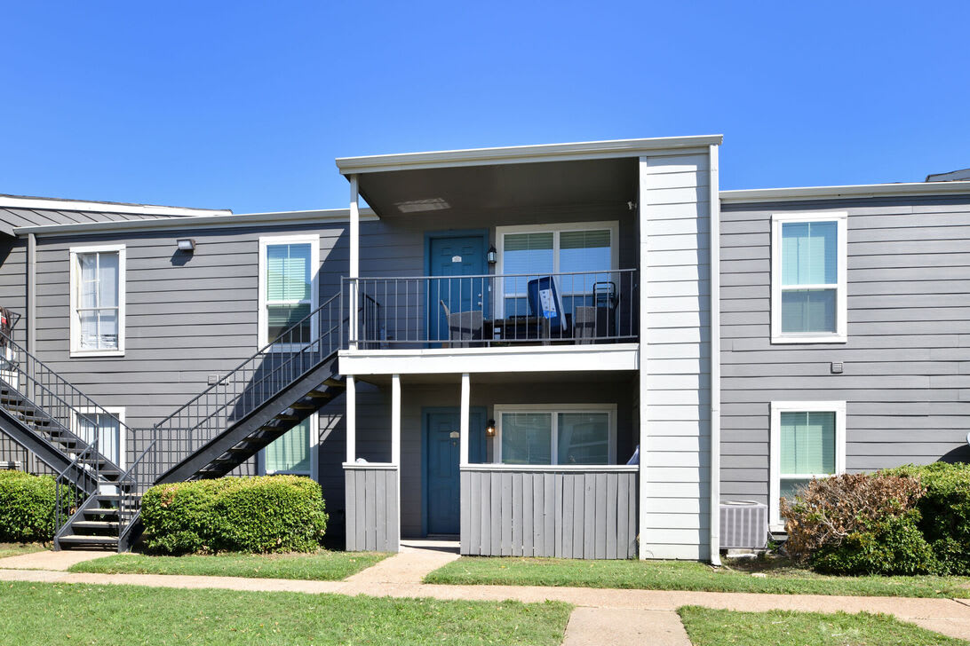 Normandy Woods apartment exterior with landscaping - Houston, TX