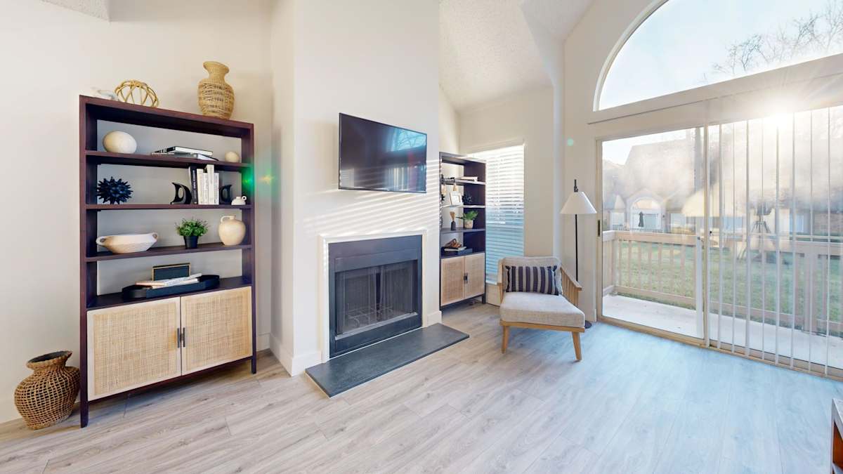 Pointe Royal living area with patio doors - Overland Park, KS