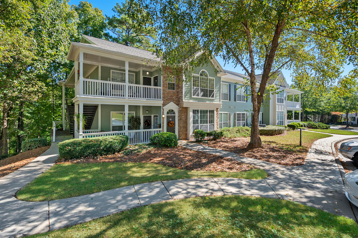 St. Andrews Apartment Homes building exterior with landscaping - Johns Creek, GA