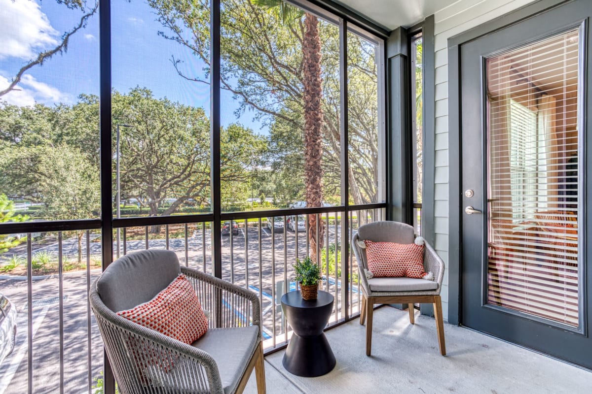 The Beck at Hidden River screened-in porch with seating - Tampa, FL