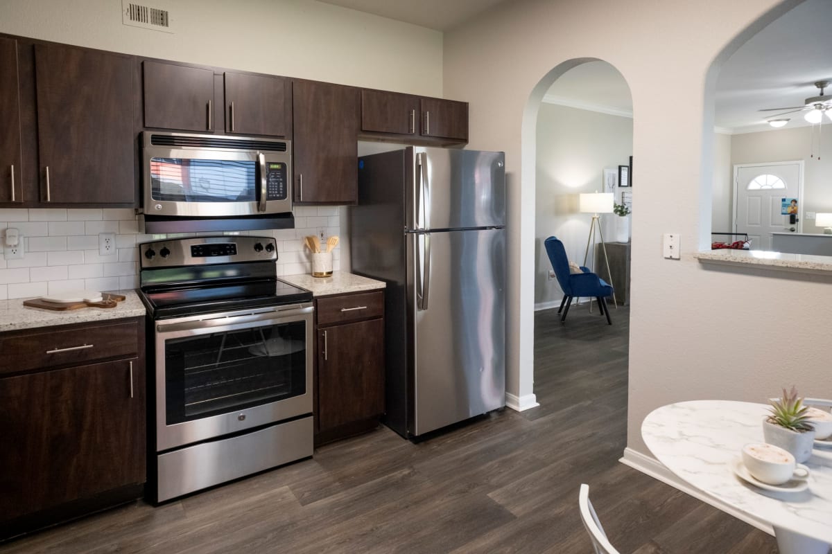 The Retreat at Steeplechase kitchen with stainless steel appliances - Houston, TX