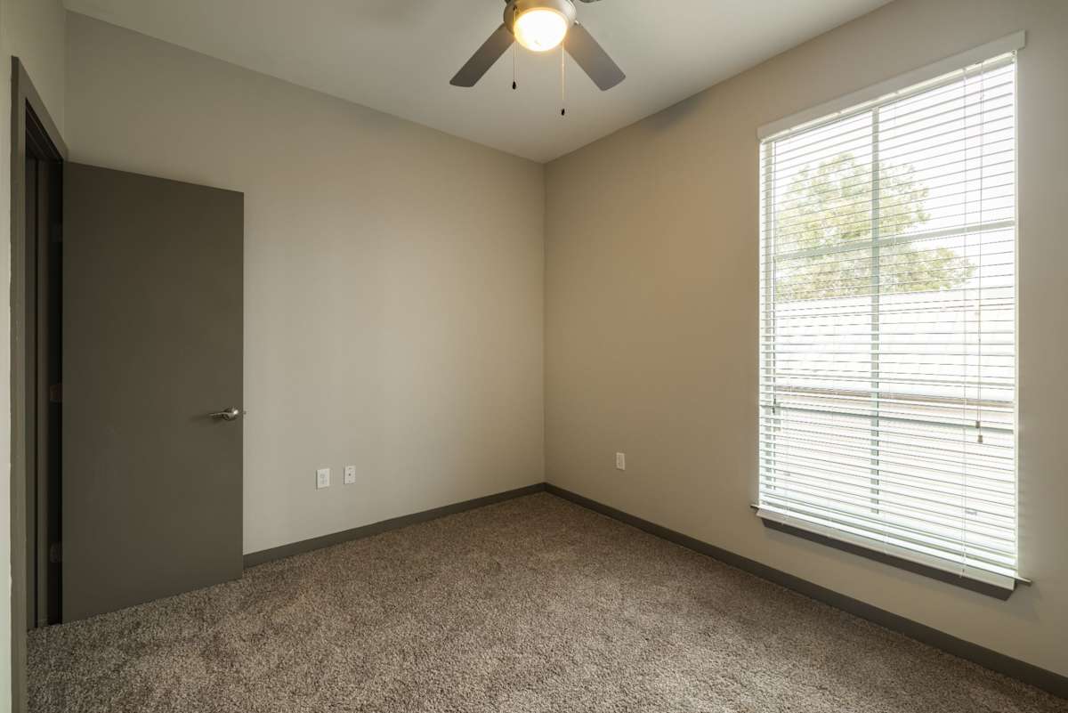 The Tennessee Brewery Apartments bedroom with ceiling fan - Memphis, TN