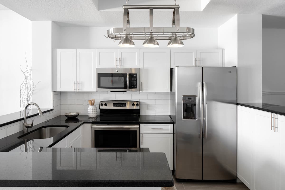 Polo Lakes kitchen with granite counters and stainless appliances - Wellington, FL