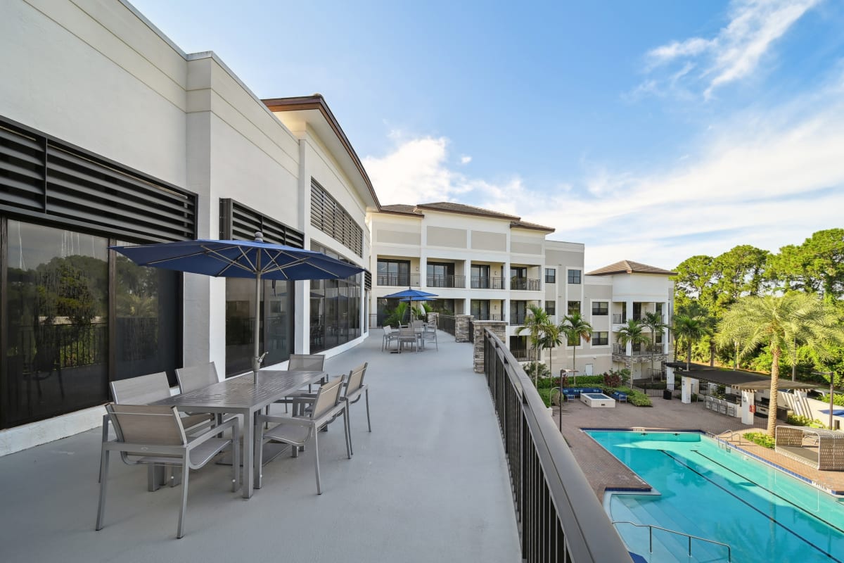 Central Gardens Grand sun terrace overlooking pool - Palm Beach Gardens, FL