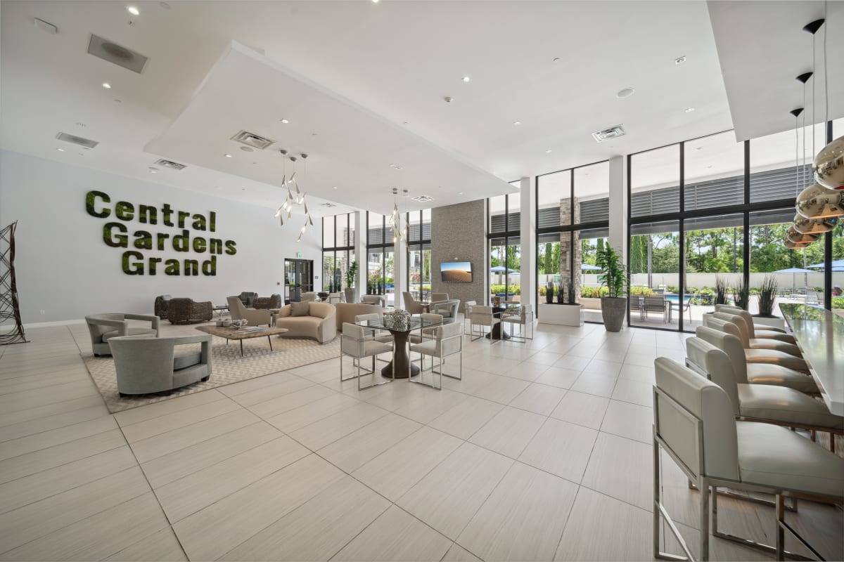 Central Gardens Grand clubhouse lounge overlooking pool - Palm Beach Gardens, FL