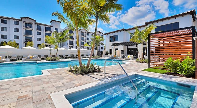Pacifica swimming pool area with sundeck seating - Boynton Beach, FL