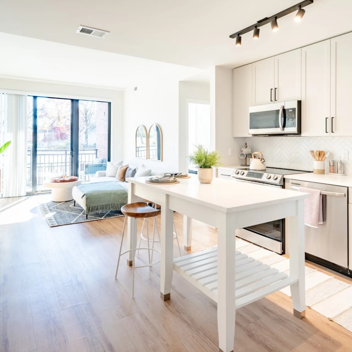 Harwood Flats apartment kitchen with island and open living area - North Bethesda, MD