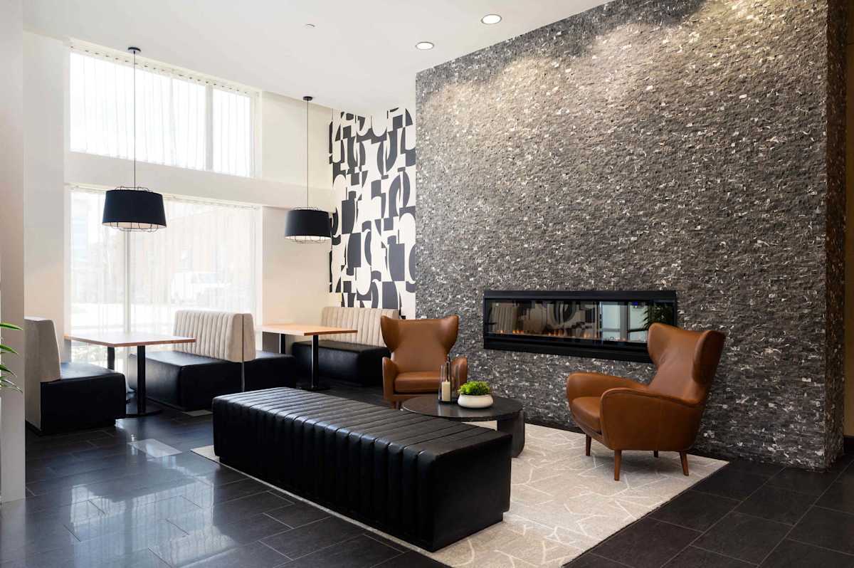 The Beacon Clarendon lobby with fireplace accent - Arlington, VA