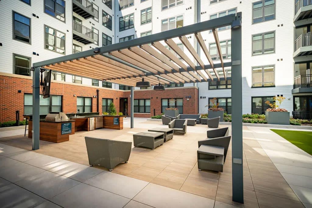 Harwood Flats courtyard patio with outdoor furniture - North Bethesda, MD