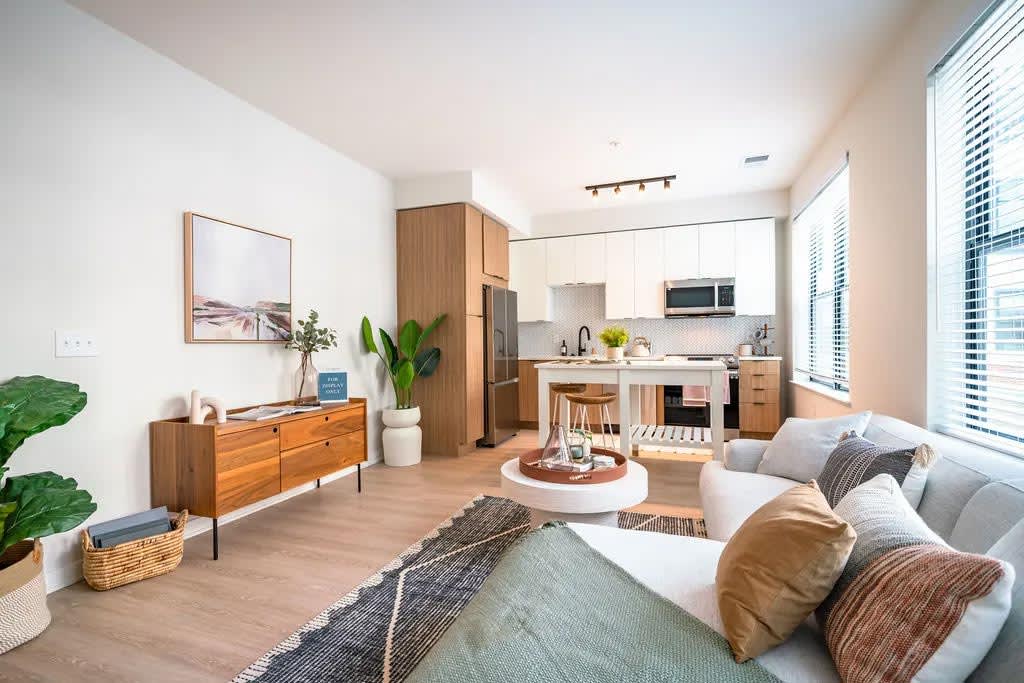 Harwood Flats apartment living room with sofa and table - North Bethesda, MD