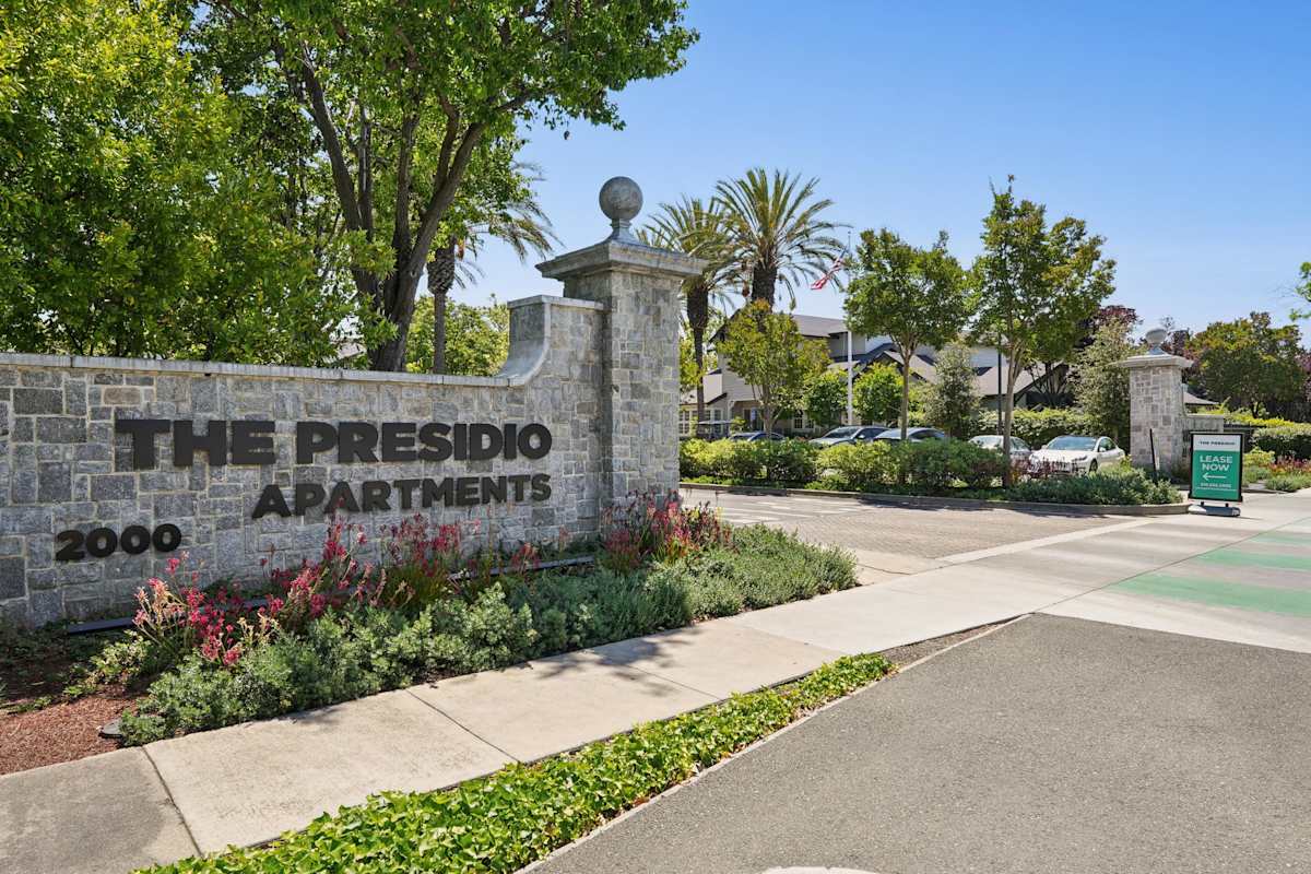 The Presidio Apartments entrance sign and walkway - Fremont, CA
