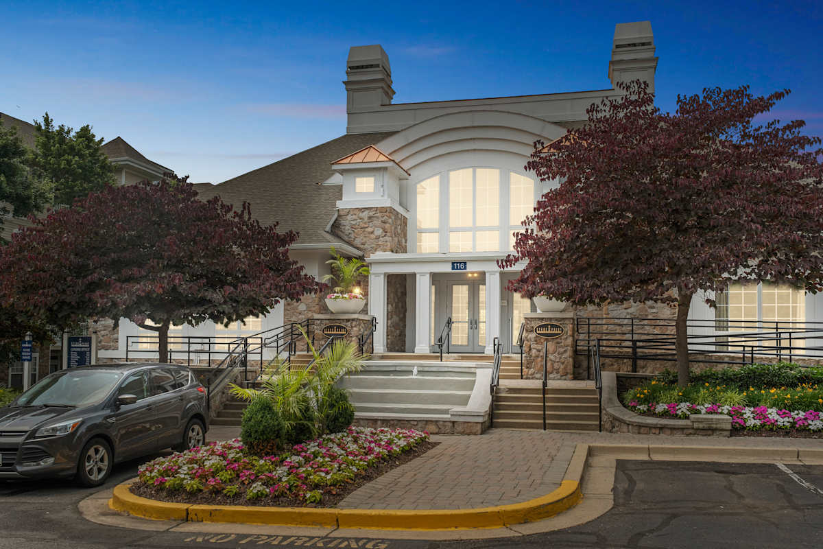 Stone Point Apartments clubhouse exterior at dusk - Annapolis, MD