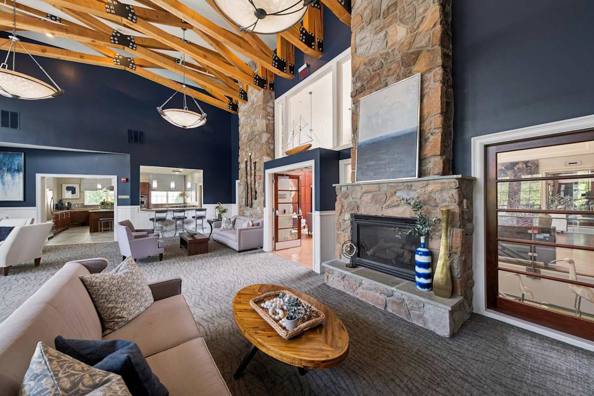 Stone Point Apartments clubhouse great room with fireplace - Annapolis, MD