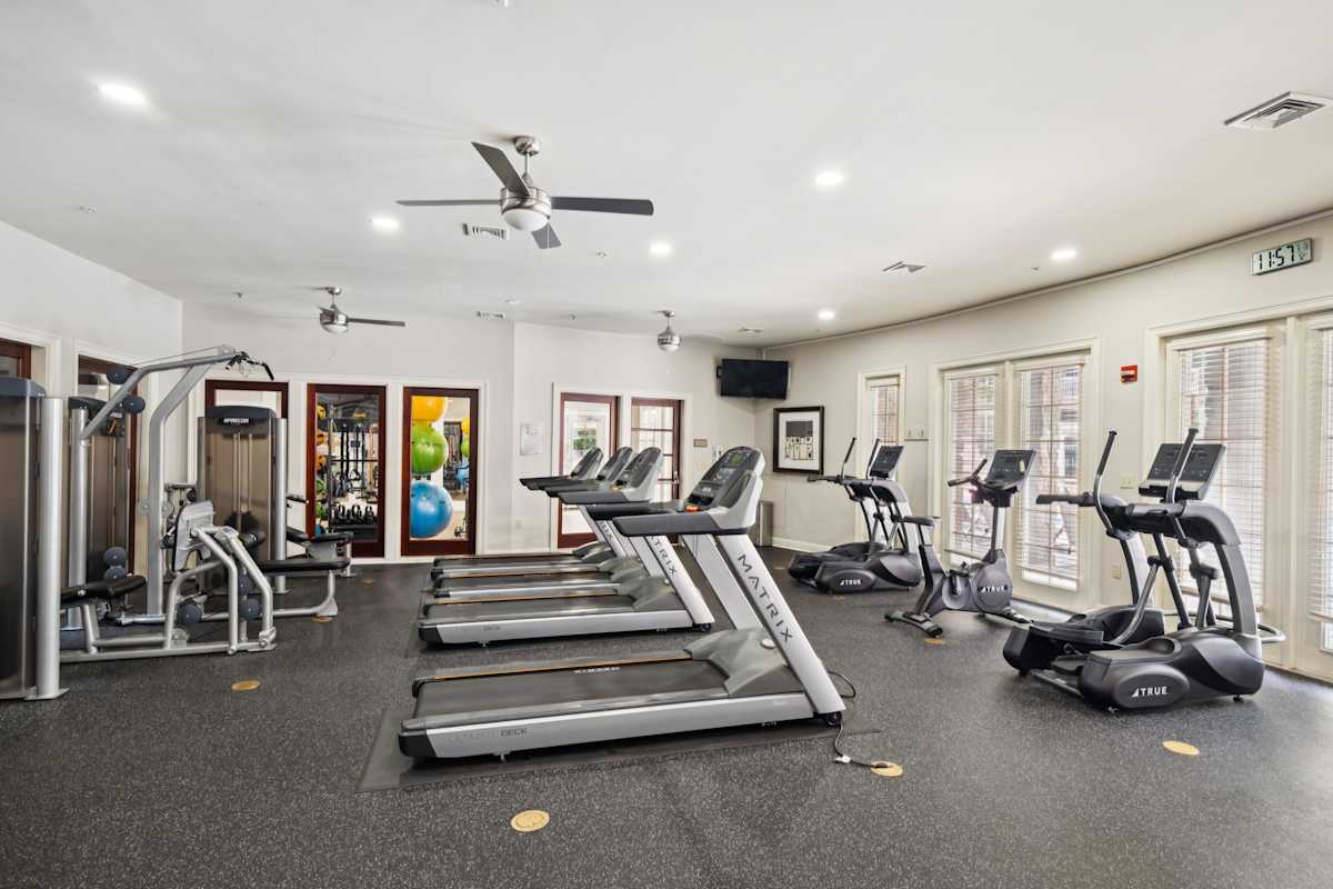 Stone Point Apartments fitness center with treadmills and weights - Annapolis, MD