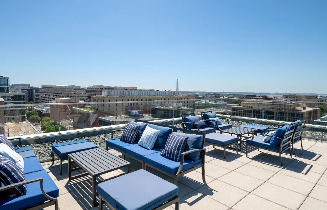 Residences on the Avenue rooftop lounge seating with monument views - Washington, DC