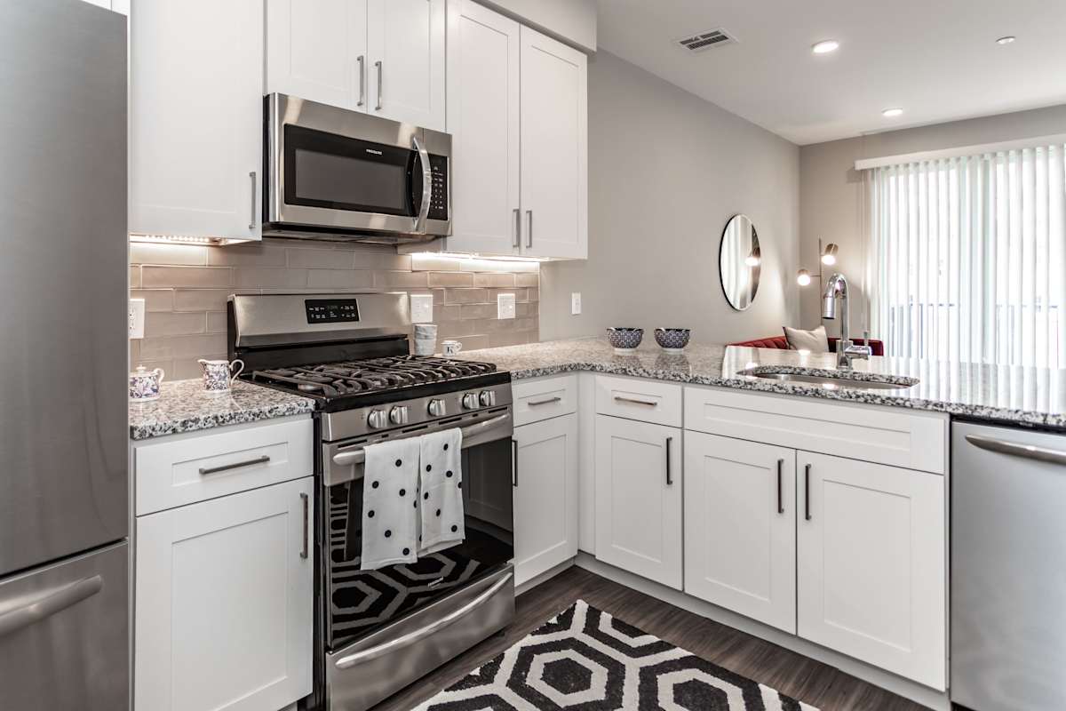 The Kelly kitchen with stainless steel appliances and stone countertops - Bala Cynwyd, PA