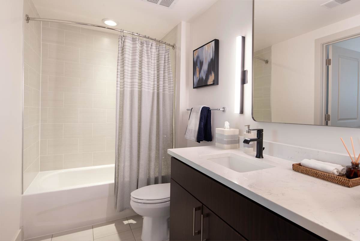 The Kingsley apartment bathroom with tile finishes - Alexandria, VA