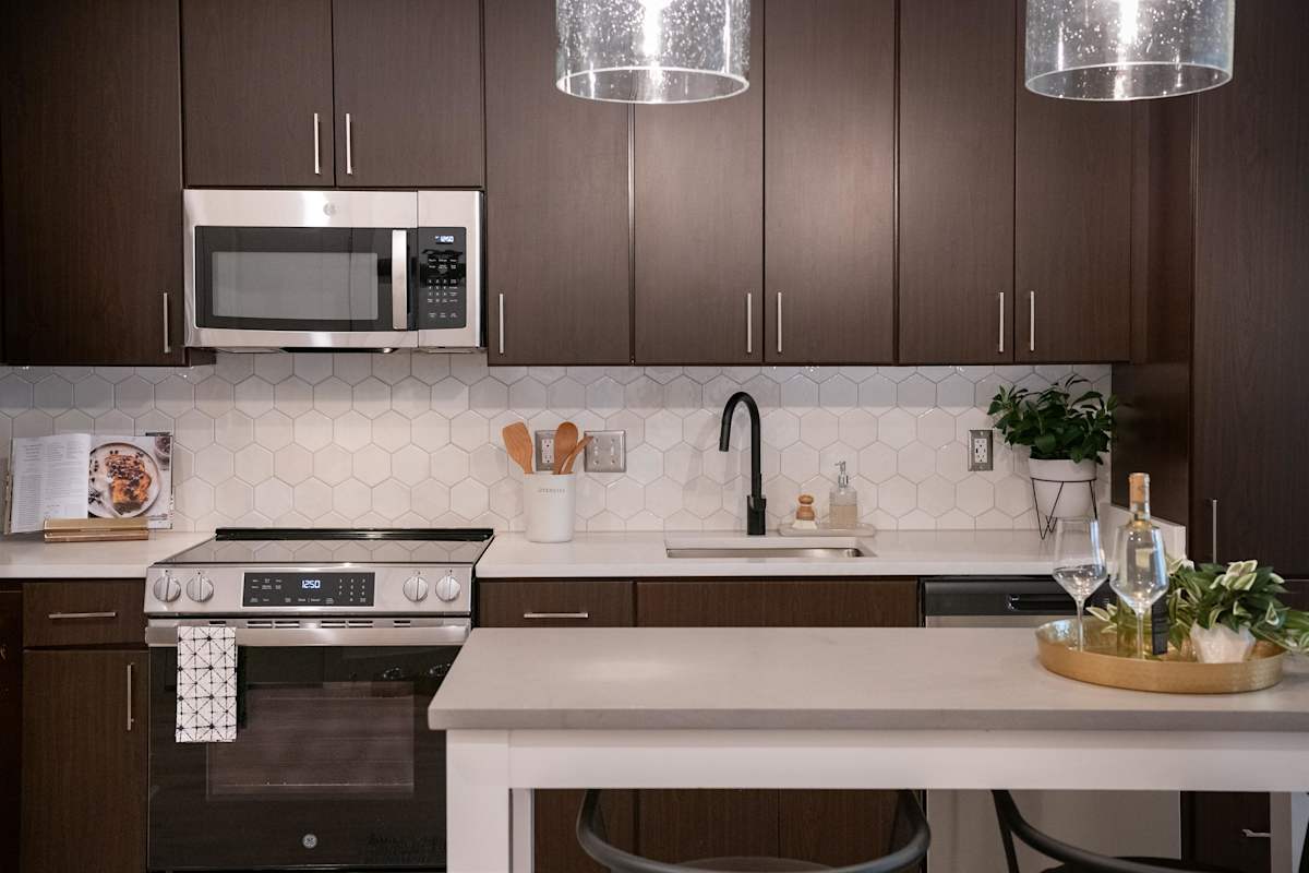 The Kingsley apartment kitchen with stainless steel appliances - Alexandria, VA