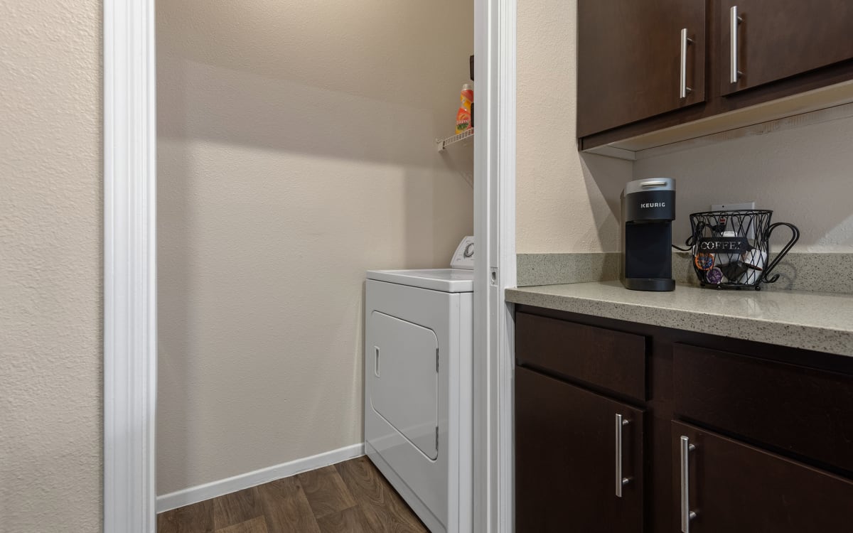 Apartment kitchen with washer and dryer at Mountainside.