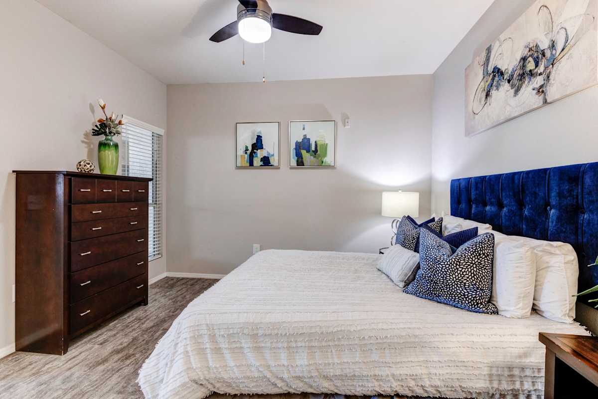 Furnished bedroom shown — representative home at Sweetwater at Metro North.