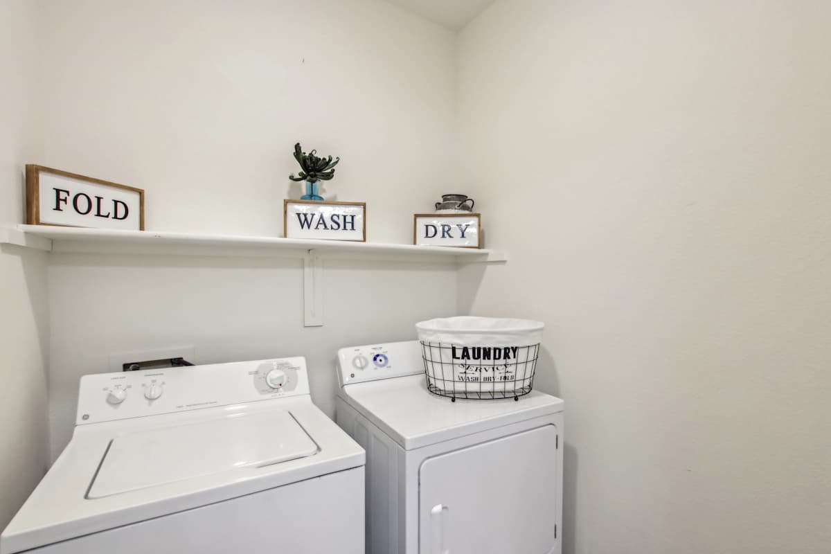In-home laundry area — representative home at Sweetwater at Metro North.