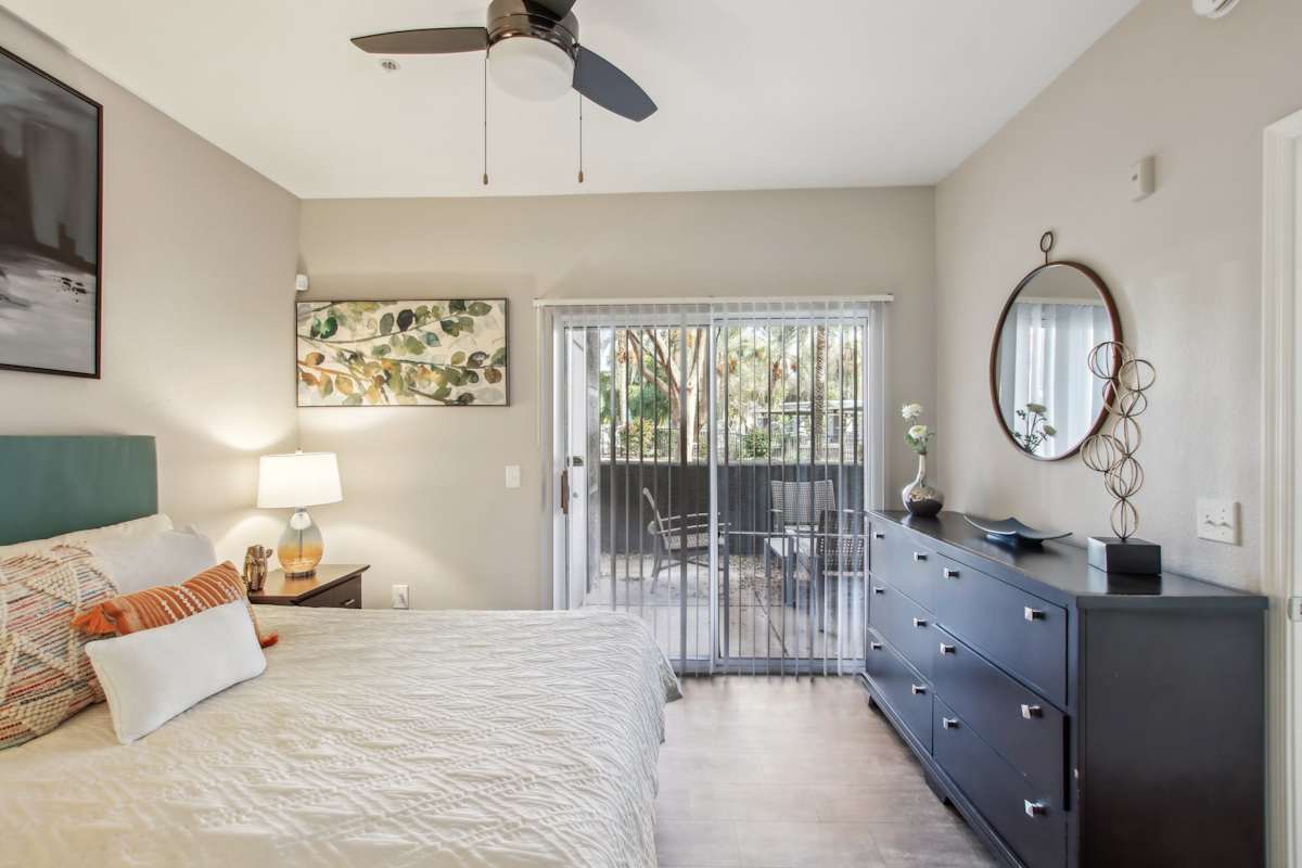 Furnished bedroom shown — representative home at Sweetwater at Metro North.