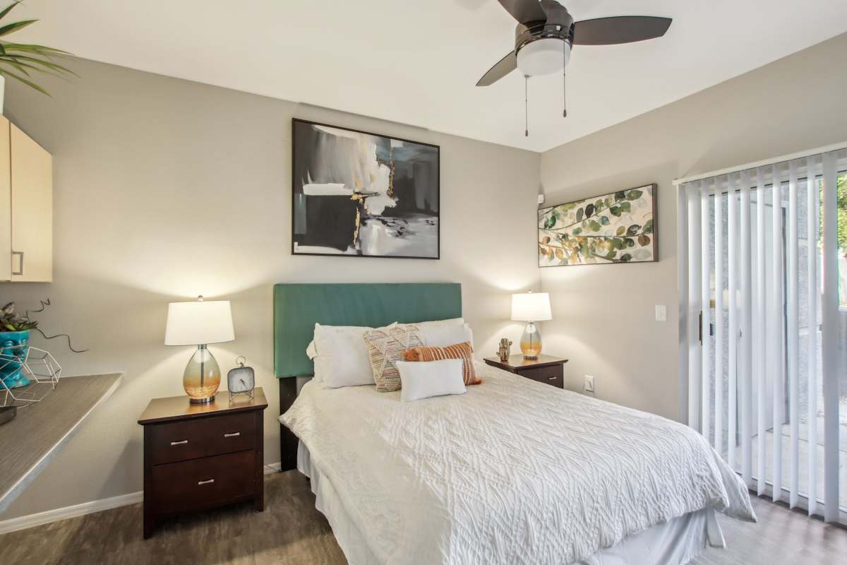 Furnished bedroom shown — representative home at Sweetwater at Metro North.