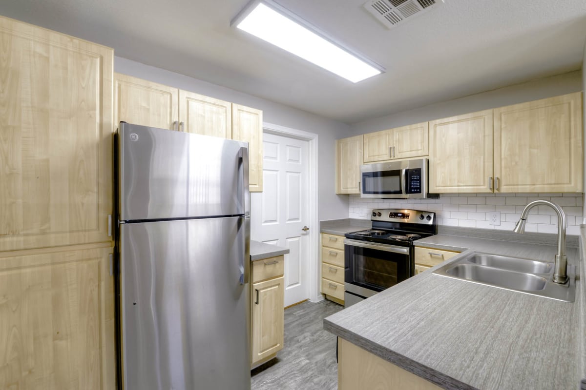 Apartment kitchen — representative home at Sweetwater at Metro North.