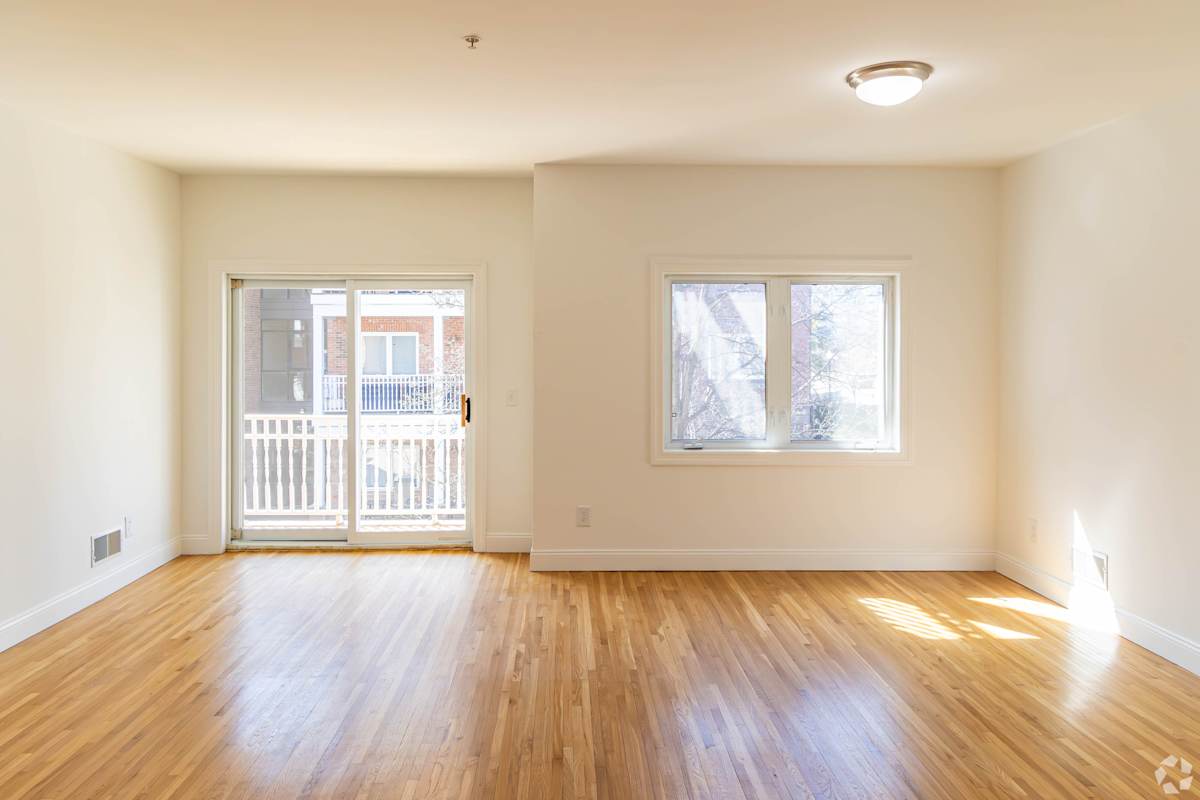Mariners Landing living room with patio access - Edgewater, NJ