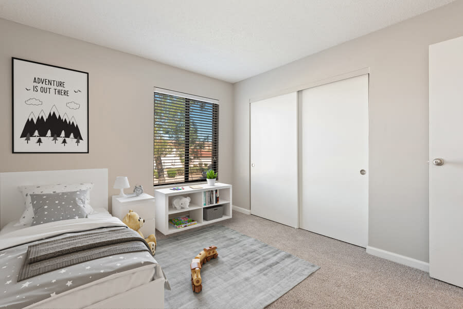 Furnished bedroom shown — representative home at Saratoga Ridge.