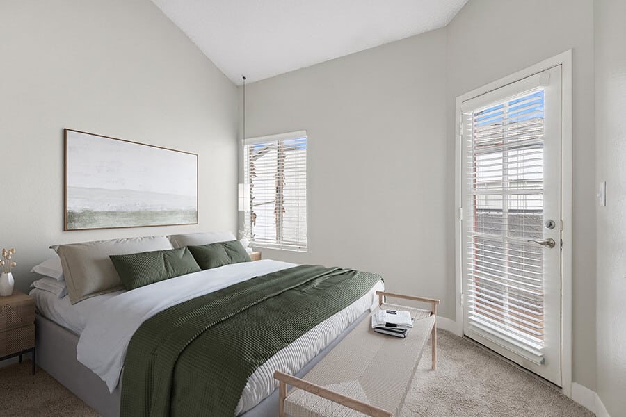 Furnished bedroom shown — representative home at Crystal Creek.